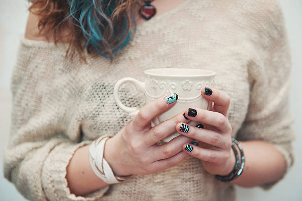 istock Woman hands holding cup of coffee 518708192