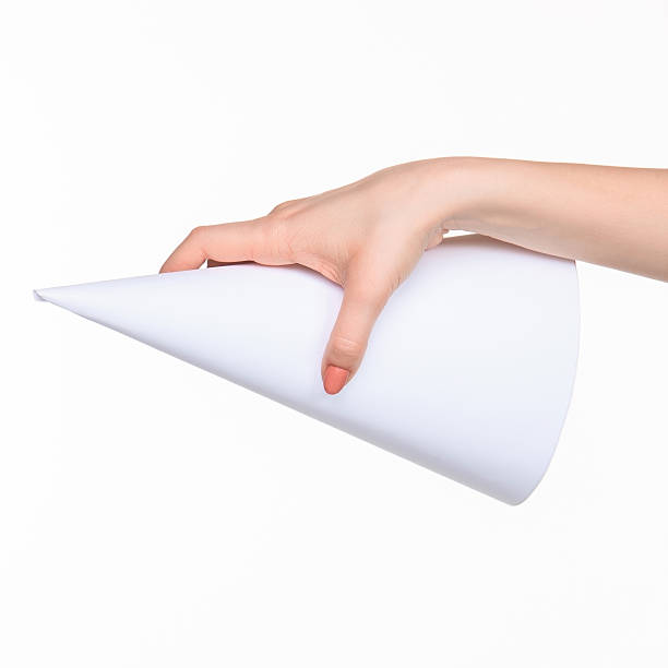 istock The cone in female hands on white background 518710528