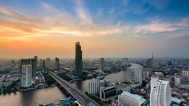 istock City downtown river curved with dramatic sky after sunset 518711348