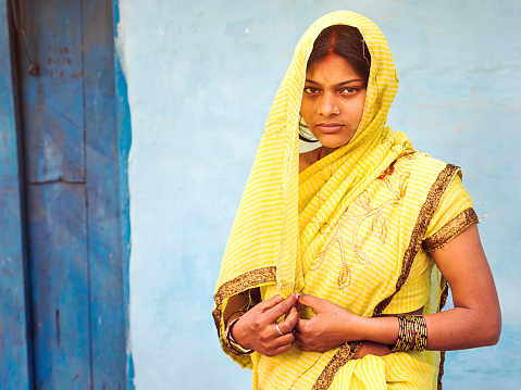 Jodhpur, India - February 11, 2013: Unidentified Indian woman wearing traditional sari dress in Jodhpur, Rajasthan, India.