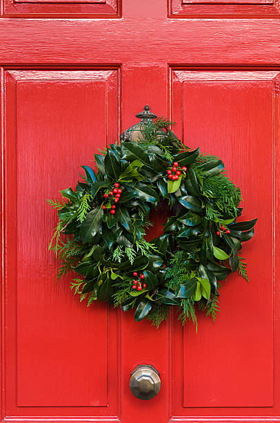 istock Christmas Wreath on a red door 518716985