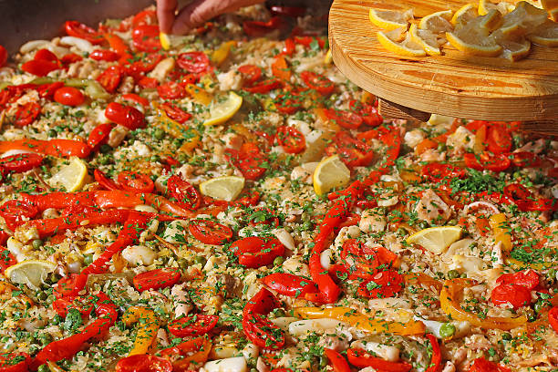 istock Valencian paella rice with seafood, red tomatoes 518717559