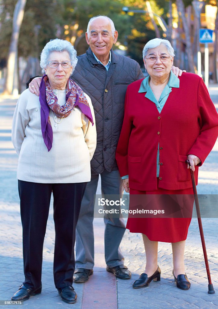 Getting older gracefully Portrait of three elderly people standing outdoors 70-79 Years Stock Photo