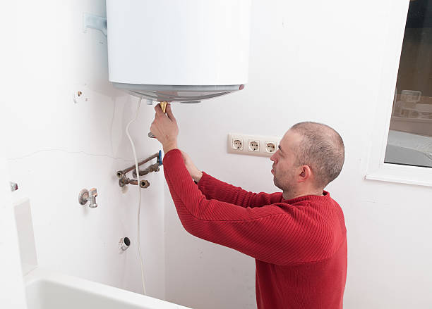 istock Plumber repairing an electric boiler 518719343