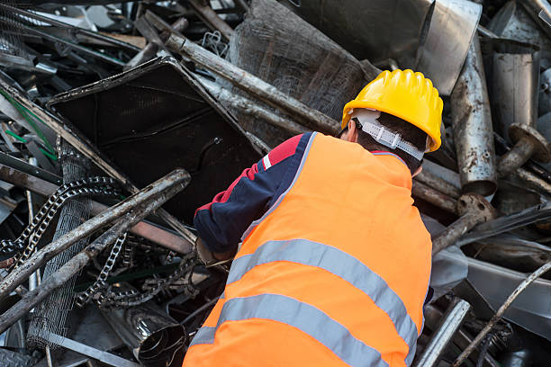 istock Worker in Metal Landfill 518720881