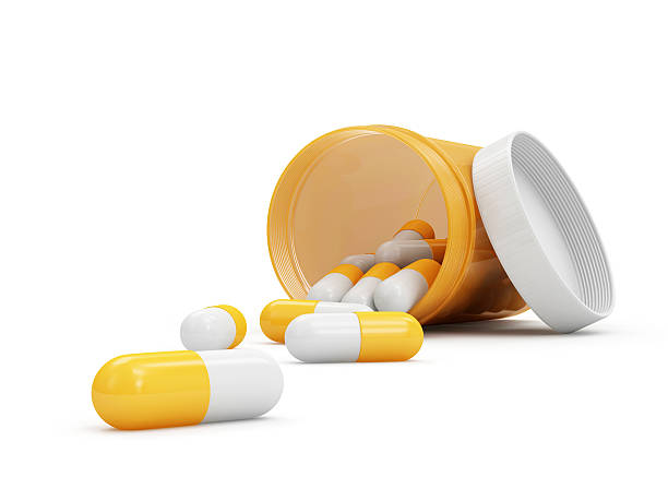 istock Medical Pills in Bottle isolated on white background 518721889