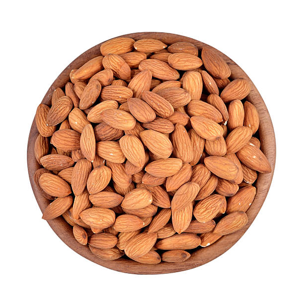 istock Peeled almonds in a wooden bowl on a white background 518722949