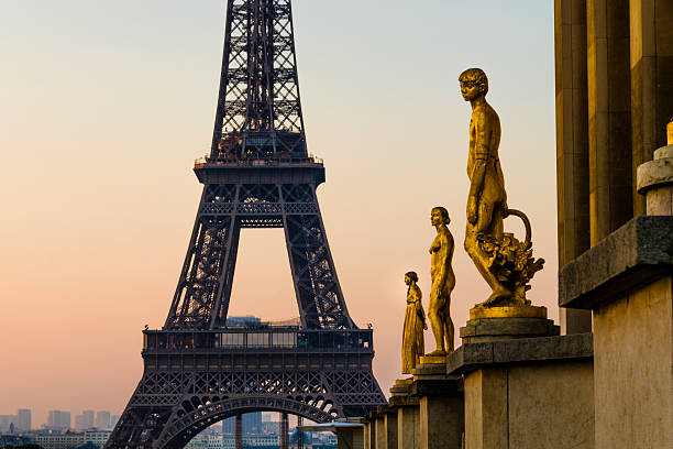 Out of focus cityscape with the Eiffel tower in Paris, France at sunrise