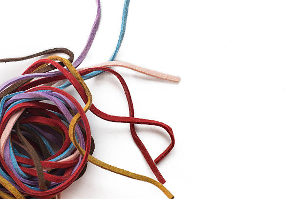 istock Colorful leather rope on white background flat lay 518727372