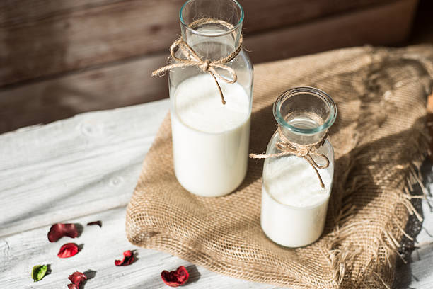 istock Bottle with milk on the wooden table 518728544