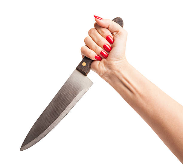 istock Female Hand Holding a Knife in a Threatening Way 518728613
