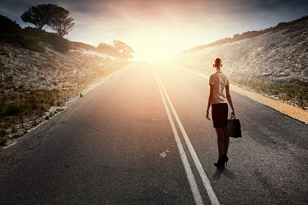 istock Businesswoman on road 518730085