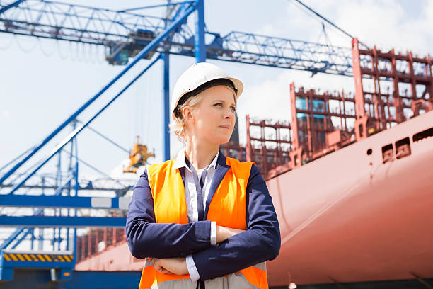 istock Confident female engineer in shipping yard 518730259