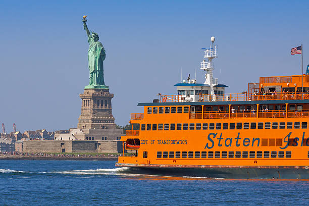 Staten Island Ferry and Statue of Liberty, New York. stock photo