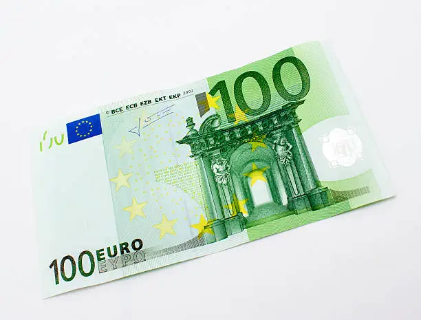 High angle view of single one hundred euro banknote over white background. Horizontal composition. Image taken in studio over isolated on white and developed from RAW format.