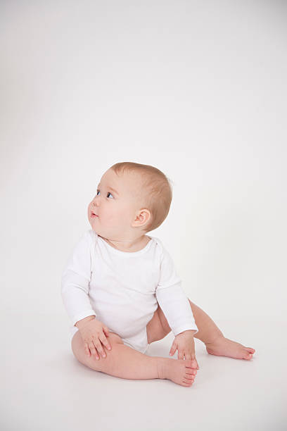 istock cute baby looking to side 518731393
