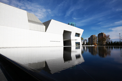 Hong Kong - October 4, 2022 : People at the M+ Museum in West Kowloon Cultural District, Hong Kong. M+ is the new museum of visual culture in Hong Kong, as part of West Kowloon Cultural District, focusing on 20th and 21st century art, design and architecture and moving image.