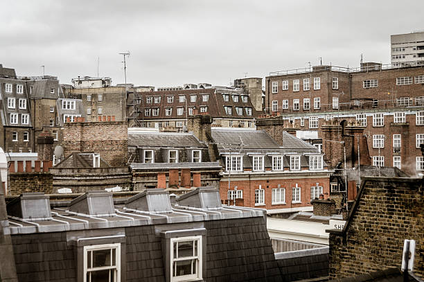 Rooftops in London Rooftops in London window chimney london england residential district stock pictures, royalty-free photos & images