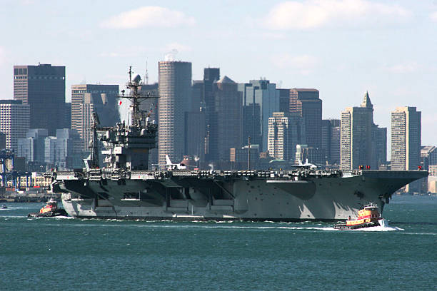 Boston Ma USA July 4 2005  USS John F Kennedy leaves Boston on its last journey to be docked at Mayport FLA . The JFK was the last non nuclear aircraft carrier and was named after the late president
