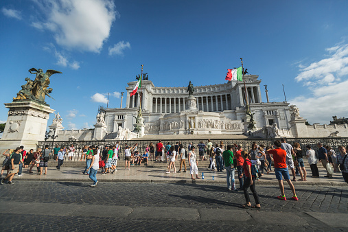 Rome, Italy - July 12, 2014: Crowd of tourists taking picture in front of Vittorio Emanuele or Altare della Patria monument in Rome