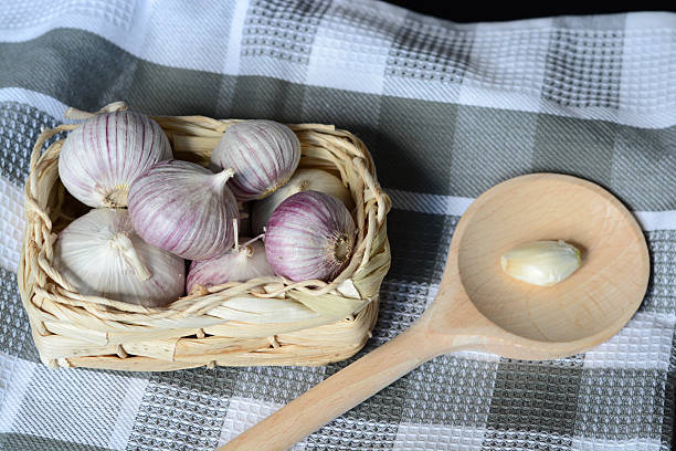 istock Country style decorated garlic on grey wood 518732241