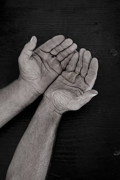istock Wrinkled handshands in offering or begging position 518732389