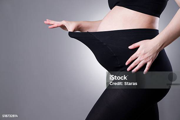 Pregnant Woman In Black Tights For Pregnant Women Stock Photo - Download Image Now - Pregnant, Leggings, Pantyhose