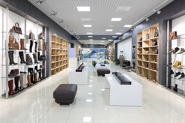interior of shoe store in modern european mall bright and fashionable interior of shoe store in modern mall boutique stock pictures, royalty-free photos & images