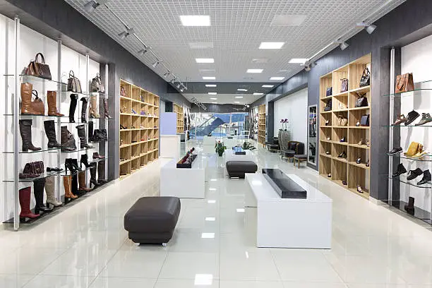 Photo of interior of shoe store in modern european mall