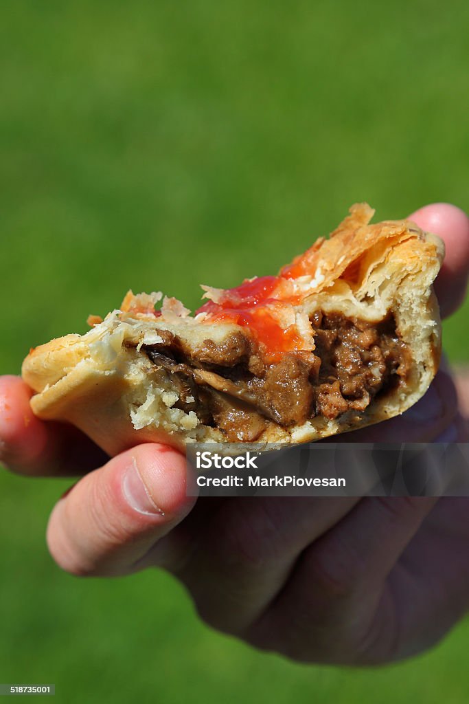 Meat Pie Half eaten meat pie ,the lunch of kings Australia Stock Photo