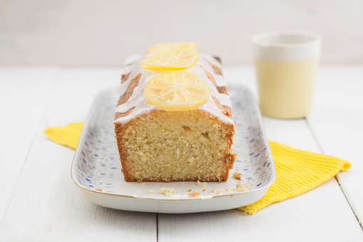 Lemon cake with icing decorated with lime slices