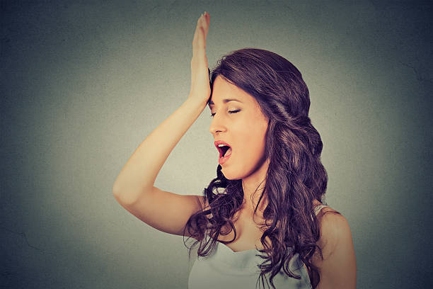 istock Regrets wrong. Woman slapping hand on head duh moment 518740106