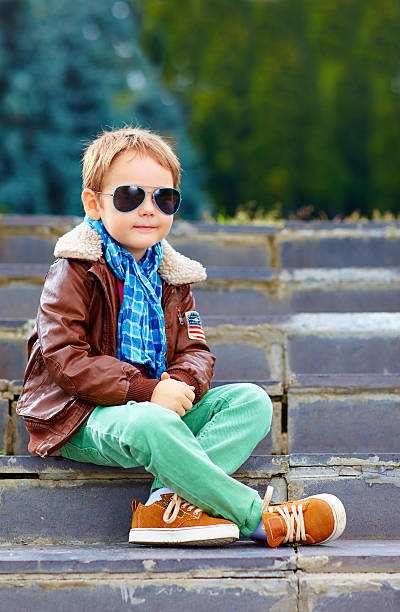 istock cute stylish boy in leather jacket and gum shoes 518752143
