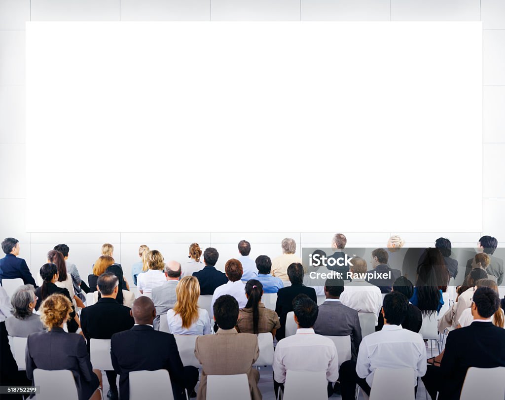 Group of Business People Looking at Blank Presentation Audience Stock Photo