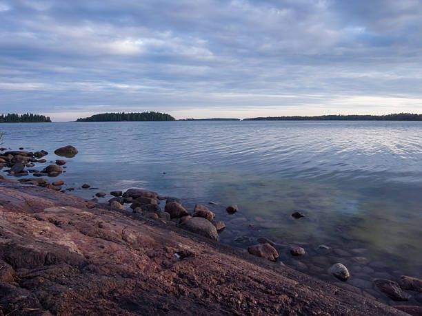 istock Seascape with rocks and sky with clouds 518753777