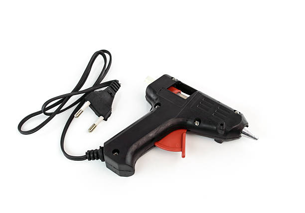istock Glue gun isolated on white background 518754285