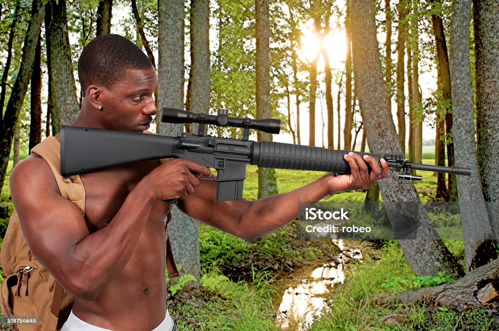 Man Carrying Assault Rifles Man With Assault Rifle Stock Photo - Download Image Now - Survivalist ...