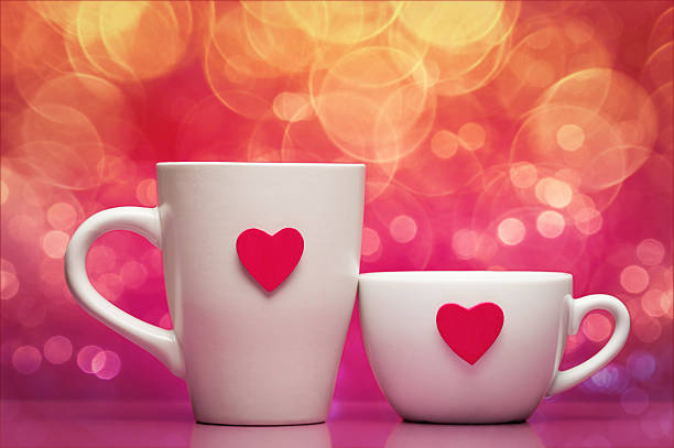 istock Cups with valentines day heart on pink background 518754893