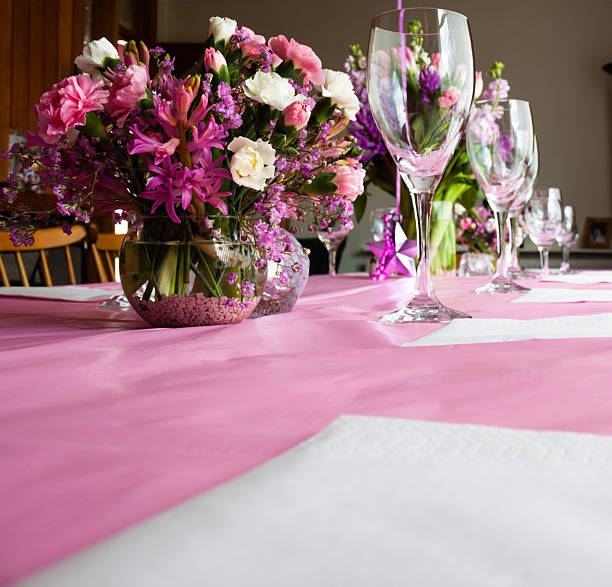 istock celebration flowers and champagne flutes on table 518755605