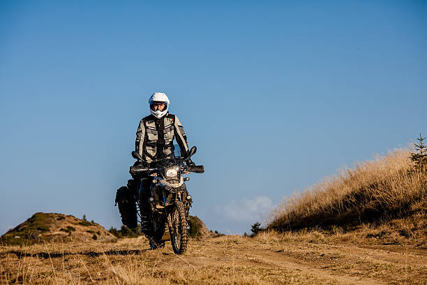 istock Motorbiker travelling in autumn mountains 518756714