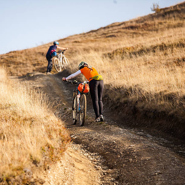 istock Biker riding in autumn mountains 518757294