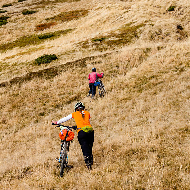 istock Biker riding in autumn mountains 518757676