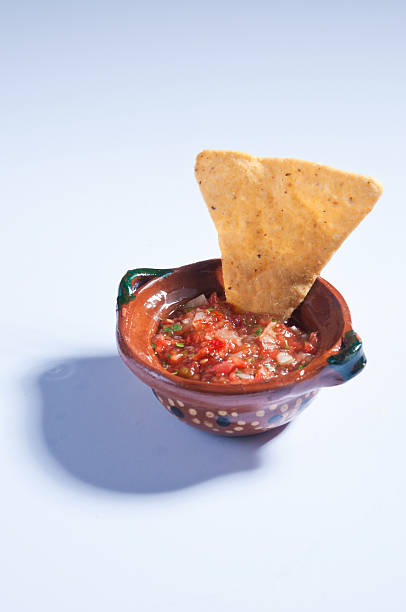 istock Mexican salsa bowl with big tortilla chip 518757677