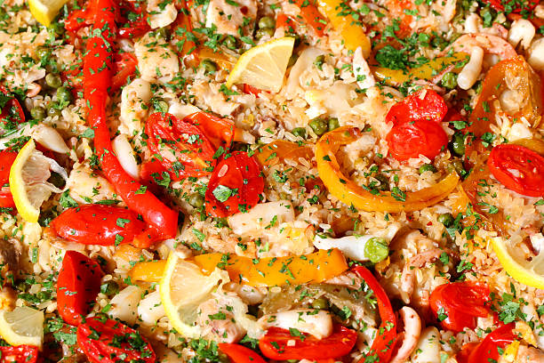 istock paella valenciana and seafood and mixed vegetables 518757713