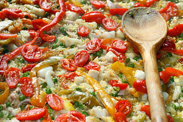 istock spoon on Valencian paella at the spanish restaurant 518757723