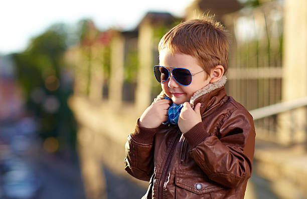 istock stylish boy hiding face from cold weather 518757839