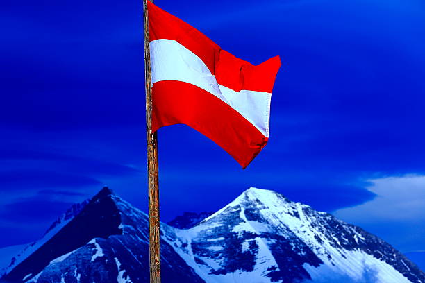 istock Austrian flag, Hohe Tauern alpine summit, dramatic sunset - Grossglockner 518758540