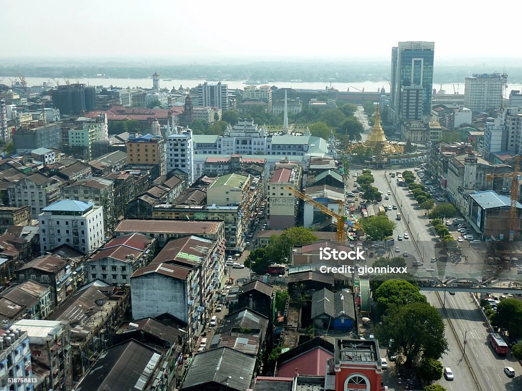 Yangon Cityscape, Myanmar Yangon downtown cityscape view from Sakura tower. In the background the golden Sule Pagoda and Yangon river,  Yangon Stock Photo
