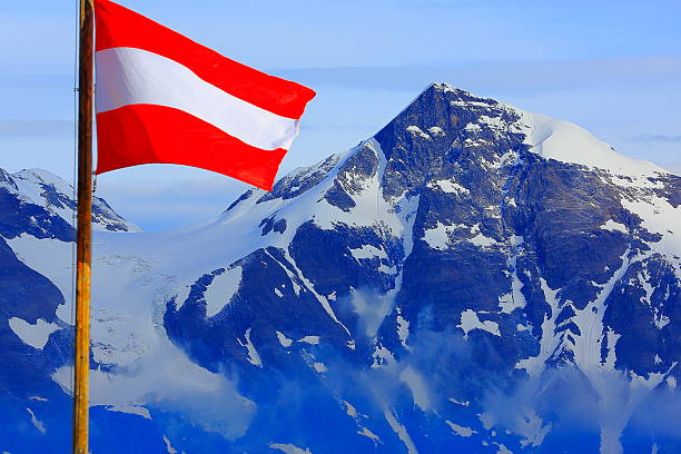 istock Austrian flag, Hohe Tauern alpine summit, dramatic sunset - Grossglockner 518758906