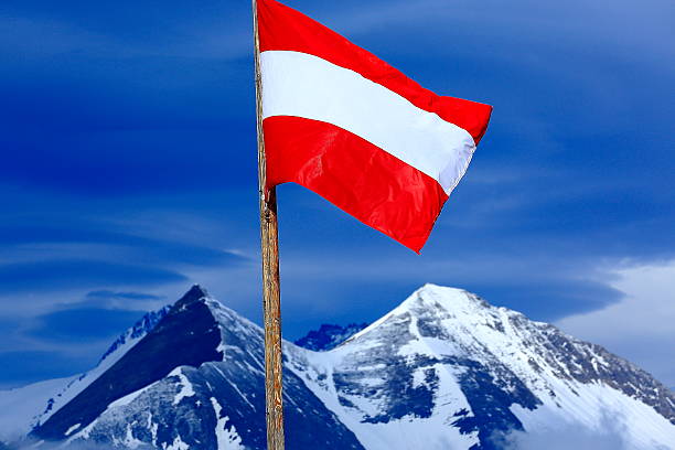 istock Austrian flag, Hohe Tauern alpine summit, dramatic sunset - Grossglockner 518759240